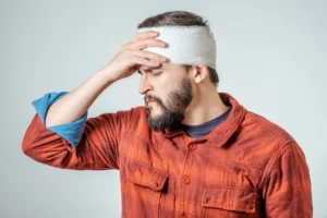 A person with a bandage on their head.